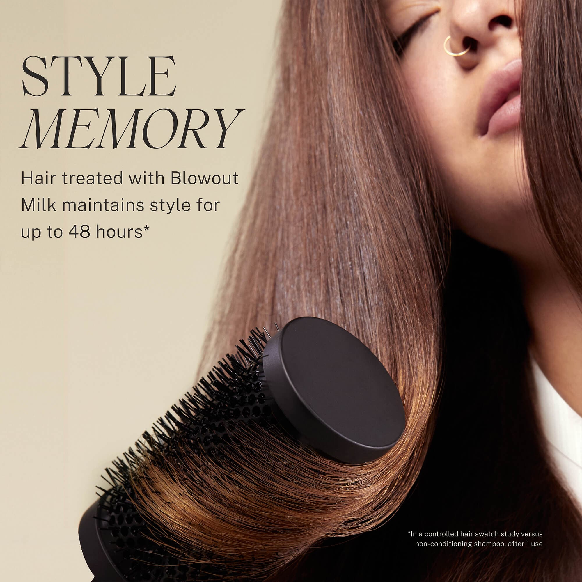 Brown hair model with round brush. Hair treated with Blowout Styling Milk maintains style for up to 48 hours. 