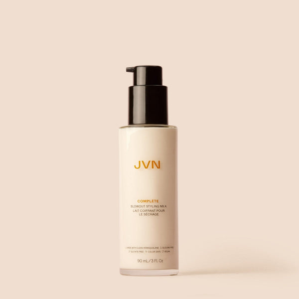 Product image of JVN Hair's Complete Blowout Styling Milk on a pink background.