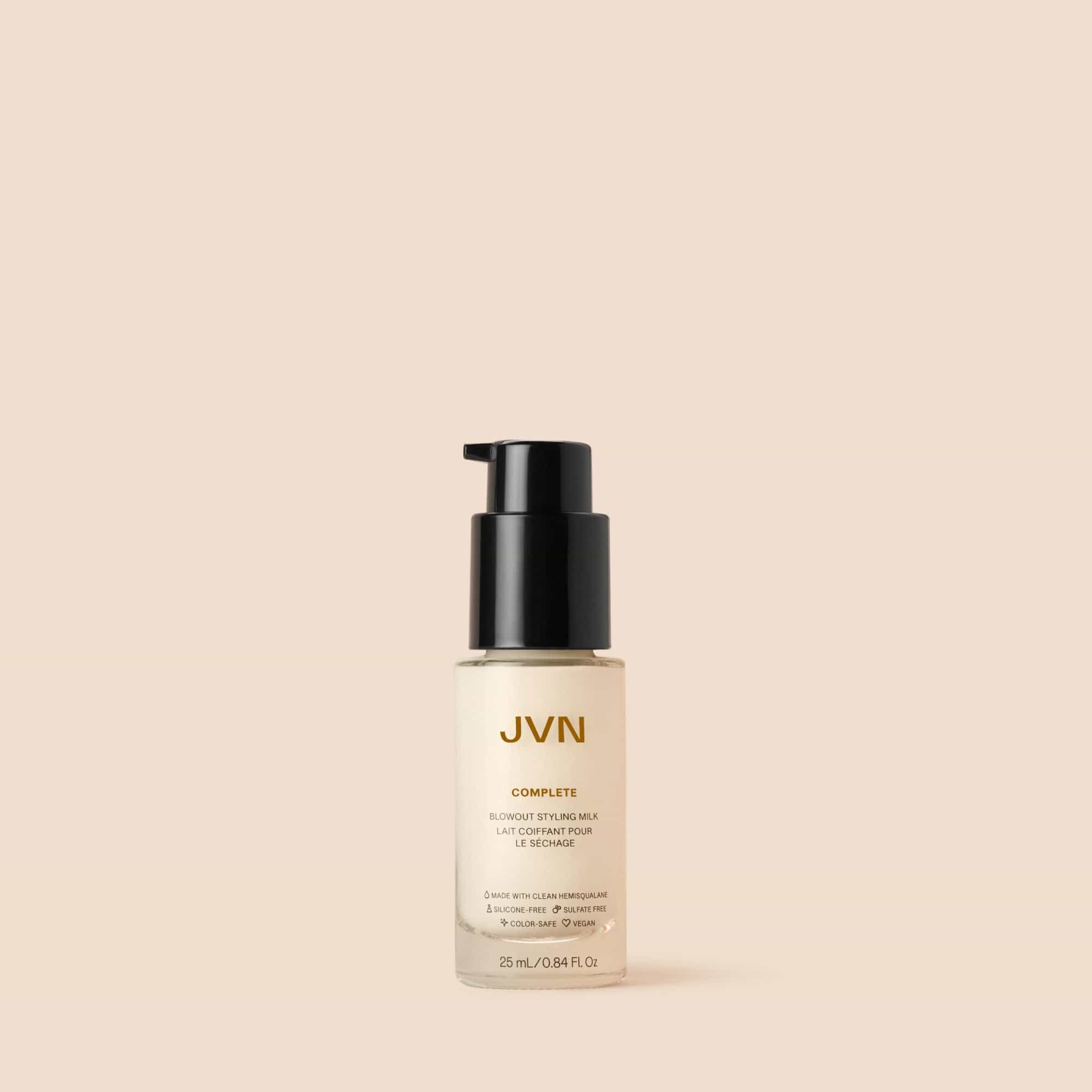 Product image of JVN Hair's Complete Blowout Styling Milk Travel on a pink background.