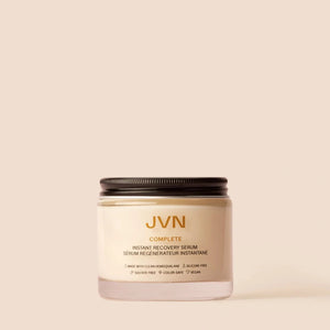JVN Hair's Complete Instant Recovery Serum on a pink background